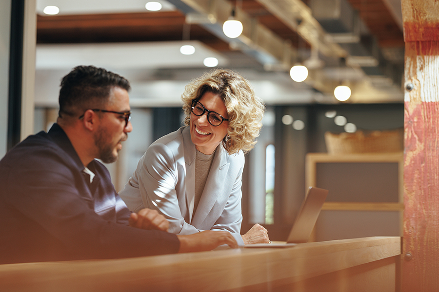 Two business people working together in a coworking office