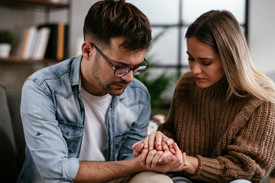 Two adults grieving