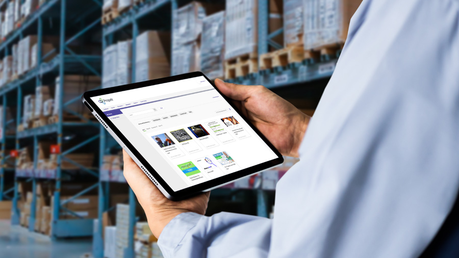 A warehouse employee using Propelr learning management system on a table device