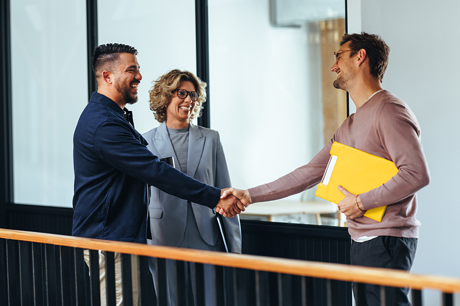 Two business people shaking hands