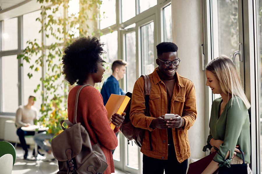 Three university students having a conversation