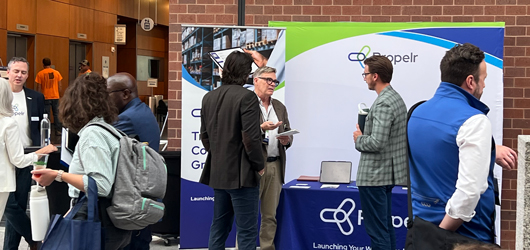 Propelr sales team connecting with prospects at a learning and development conference