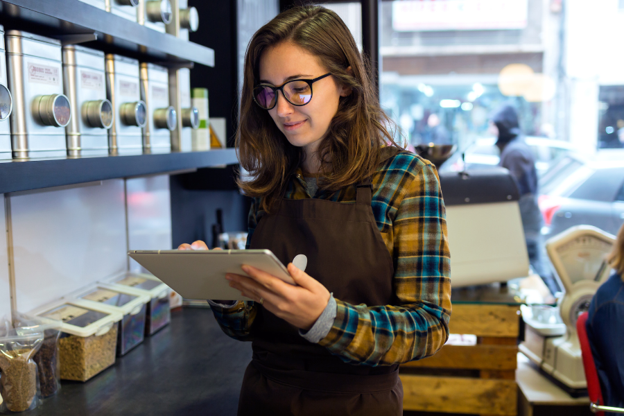 An employee using a tablet device for learning